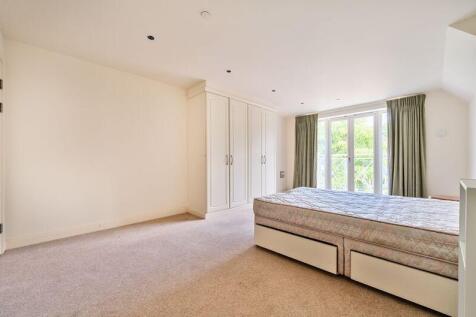 Bedroom with fitted wardrobes and ens...