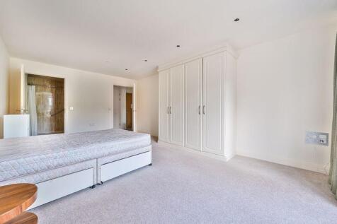 Bedroom with fitted wardrobes and ens...