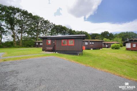 Front of chalet / parking