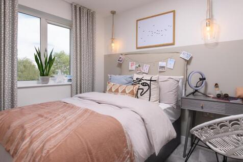A double bed and desk area would fit in bedroom 3