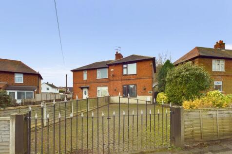 Front with Gates and Driveway