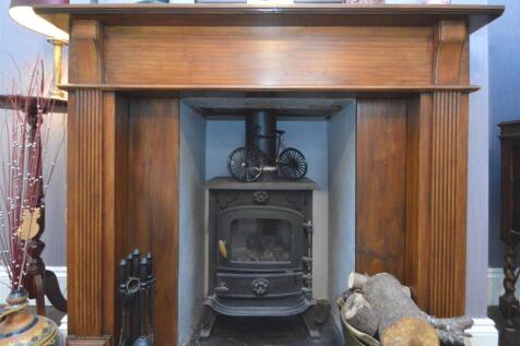 Cosy Fireplace within the dining room