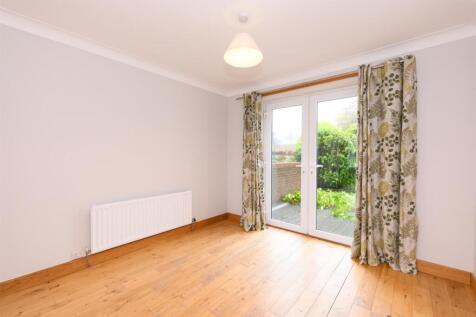 THROUGH LOUNGE/DINING ROOM