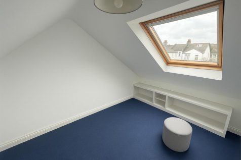 Bright Attic Room with Skylight.png