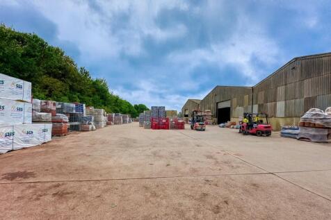 Industrial Yard and Forklifts at Work.png