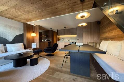 A modern, cozy living space features a wooden inte