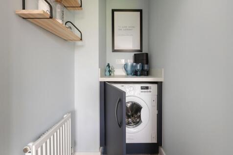 A handy utility space sits off the kitchen/diner
