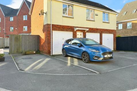 Two Parking Spaces and Garage