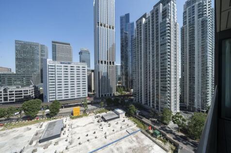 Experience the dynamic energy of the city from your window with this stunning urban skyline.