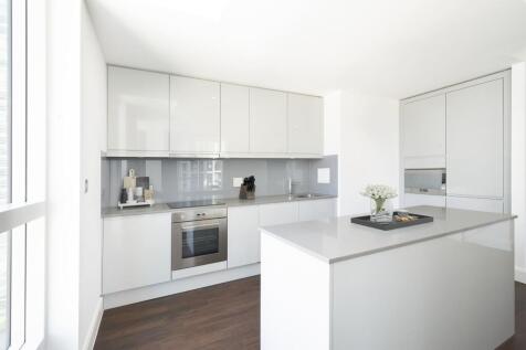 Step into the elegance of this modern kitchen, where style meets functionality.