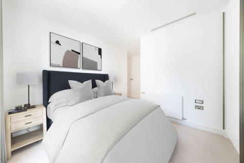 Experience the serene elegance of a modern bedroom, perfect for relaxation.