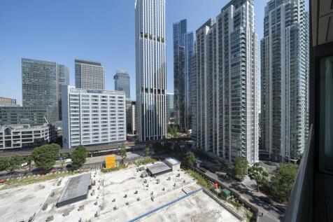 Experience the dynamic energy of the city from your window with this stunning urban skyline.