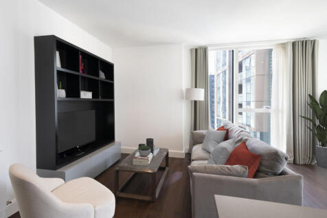 Experience luxury in this contemporary urban living room, offering ample natural light and sophisticated design.
