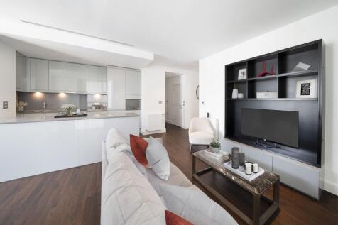 Experience modern elegance in this open-concept living area with a sleek, well-equipped kitchen.