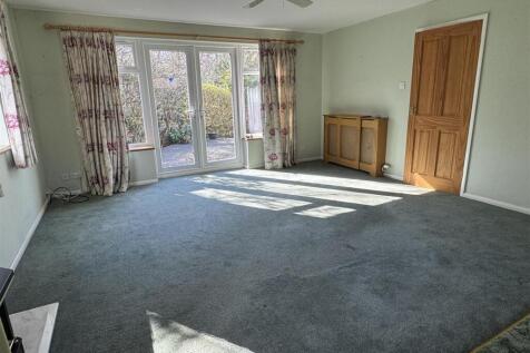 LIVING ROOM/BEDROOM FOUR: