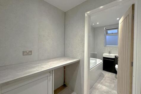 Utility area and downstairs bathroom