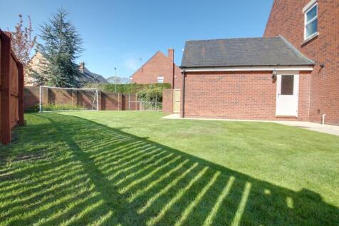 Part of the rear garden and side garden