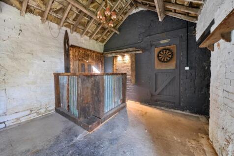 Outbuilding bar with adjacent guest WC