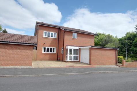 Taken from Magdelene Close showing both garages