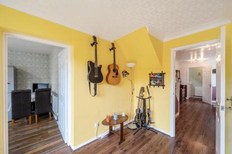 Dining area showing kitchen and hallway 