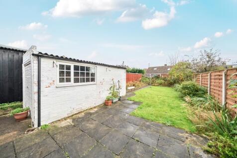 Back garden showing garage