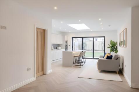 Kitchen and living area virtually staged