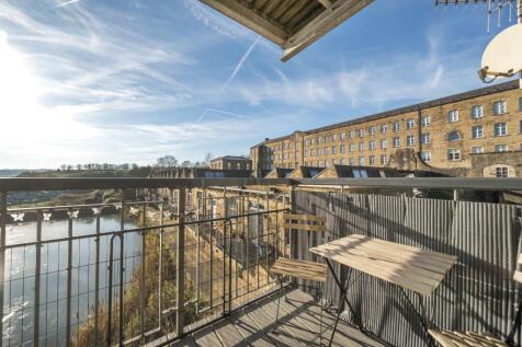 Balcony of apartment overlooking mill pond