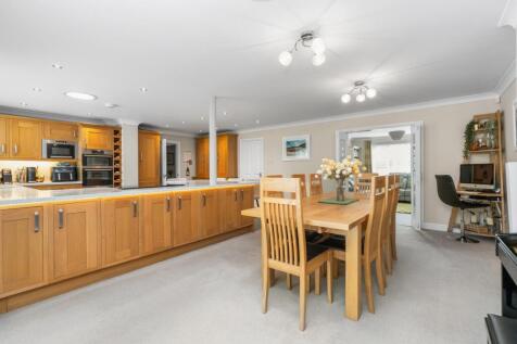 Dining area and living room through the doors
