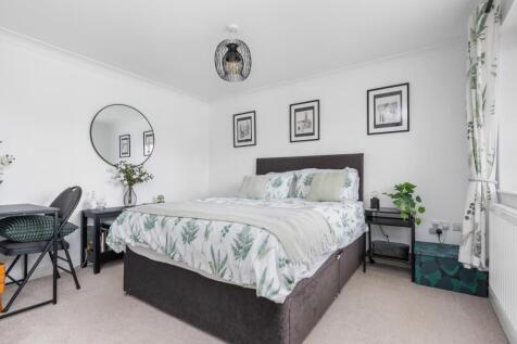 This spacious room easily fits the kingsize bed