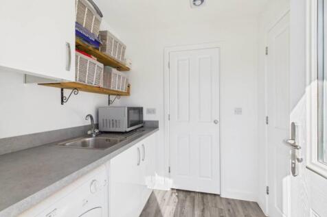 A view from the back door showing a cupboard housi