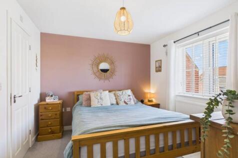 The main bedroom with its large window is the perf