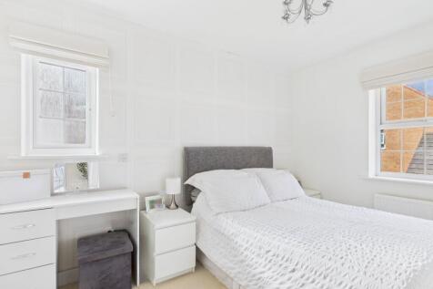 The main bedroom gives chic hotel vibe