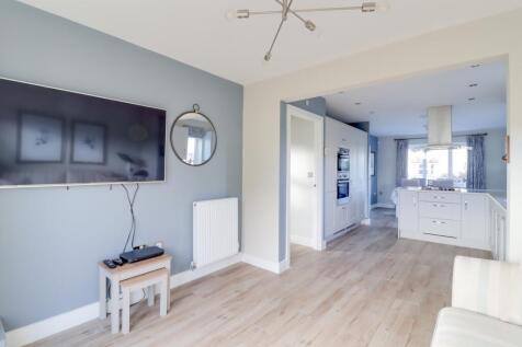 Living area in kitchen with French doors into gard