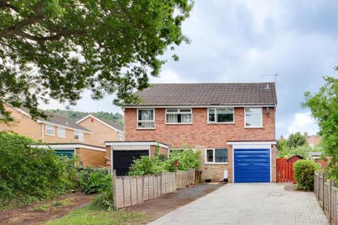Front of house showing drive and garage
