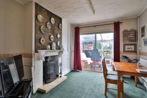log burner and original storage cupboard