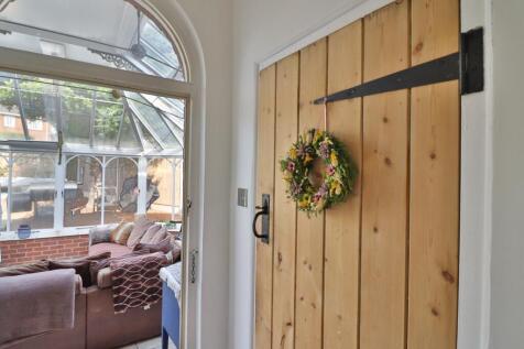 Utility door and view into Orangery