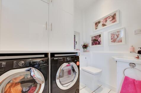 Utility and cloakroom  with fitted storage