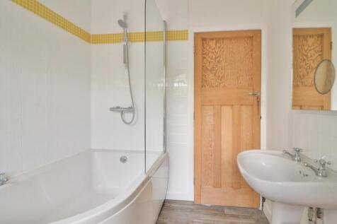  Bathroom comprising Bath with Shower over Bath Ba