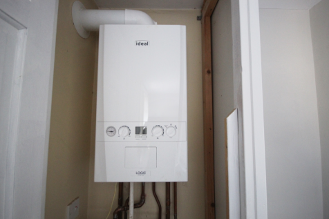boiler within storage cupboard in bedroom 2 