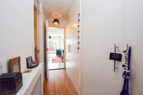 Hall showing storage cupboards
