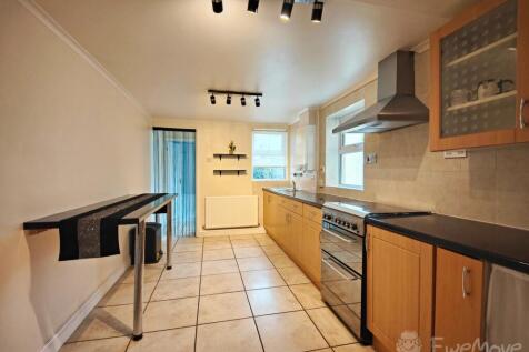 Kitchen leading to ground floor bathroom and rear 