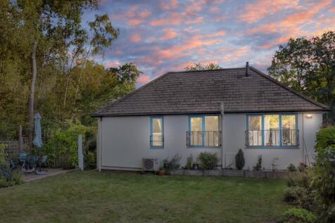 Side view of the property at dusk