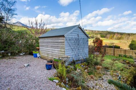 Timber shed and parking area