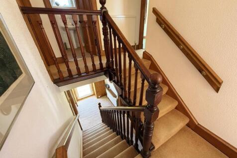 Stairs down to front door