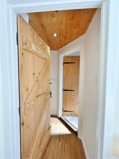 Into hall towards shower room