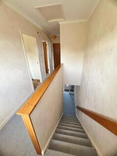 Upper hallway down to front door