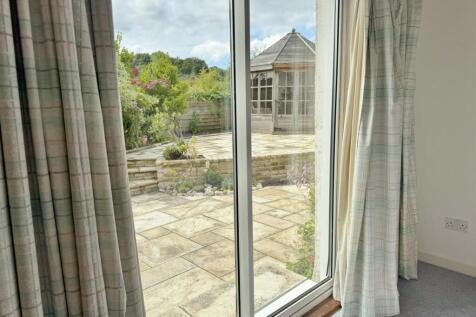 Bedroom 3 patio doors to rear garden