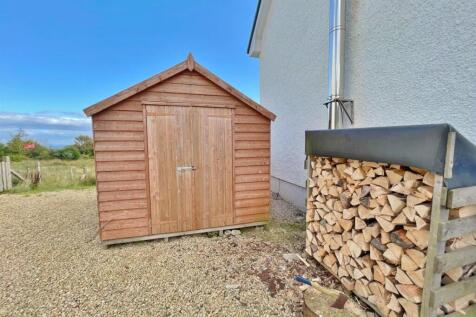 Timber shed and log store