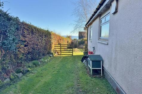 Side gardens and view south