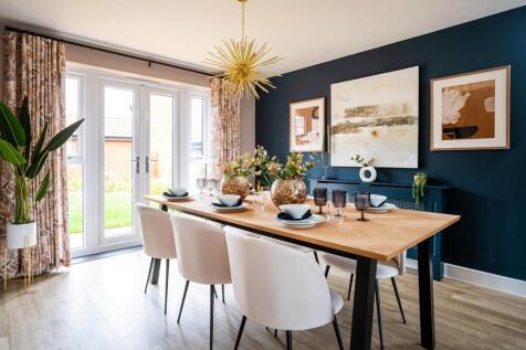 Double doors lead from the dining area to the garden, perfect for alfresco dining